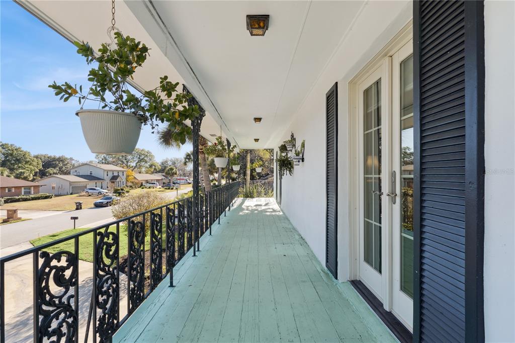 7621 Orange Tree Lane Orlando, FL 32819 - Photo 26 of 47 a view of a porch with wooden floor