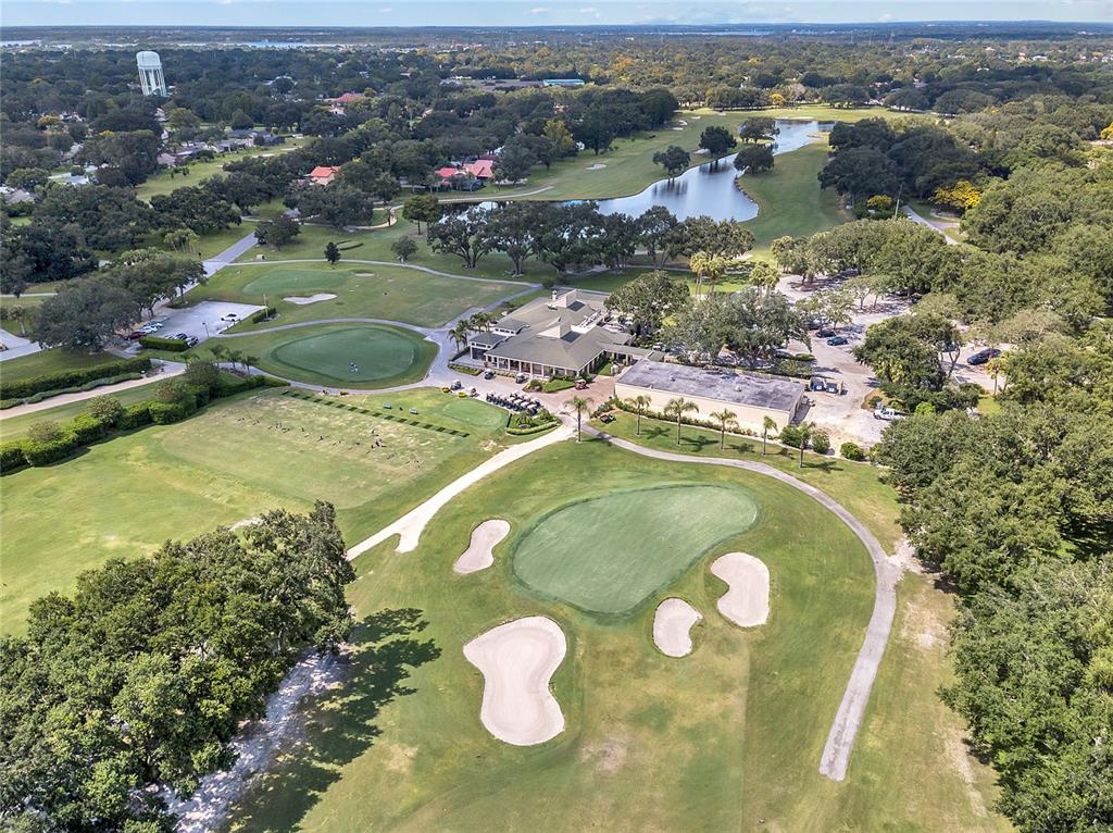 7621 Orange Tree Lane Orlando, FL 32819 - Photo 44 of 47 an aerial view of a house with a swimming pool and mountains