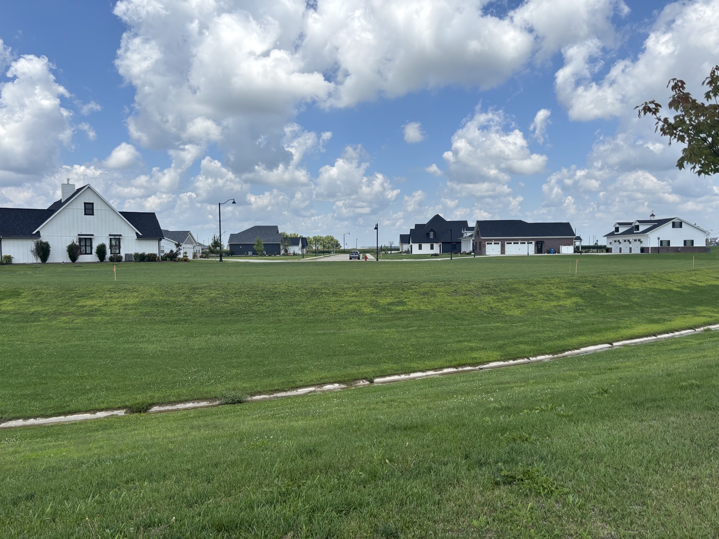 1 Pointe Boulevard Peru, IL 61354 - Photo 4 of 6 a backyard of a house with lots of green space table and chairs