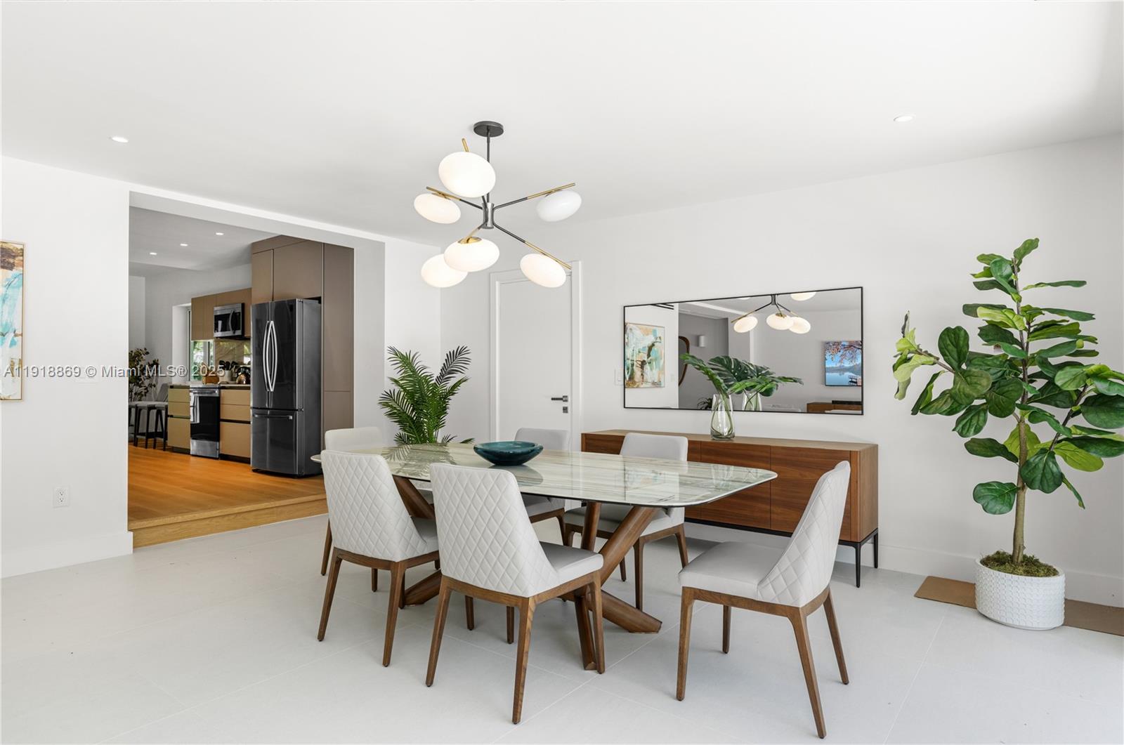 45 Northeast 104th Street Miami Shores, FL 33138 - Photo 11 of 52 a view of a dining room with furniture and chandelier