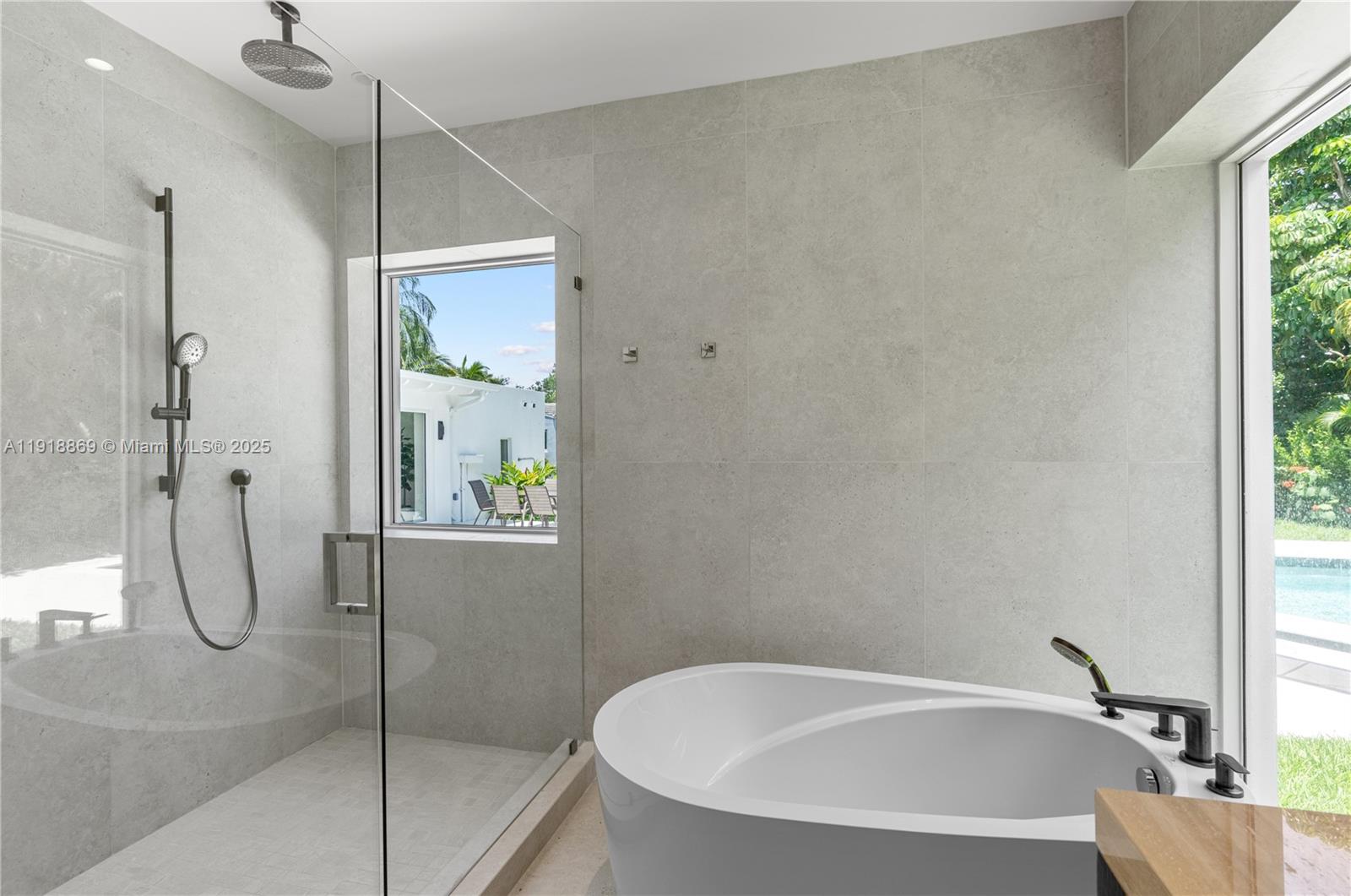 45 Northeast 104th Street Miami Shores, FL 33138 - Photo 29 of 52 a bathroom with a bathtub and a shower