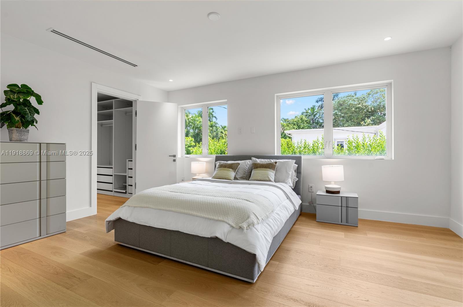 45 Northeast 104th Street Miami Shores, FL 33138 - Photo 32 of 52 a bedroom with a bed and window