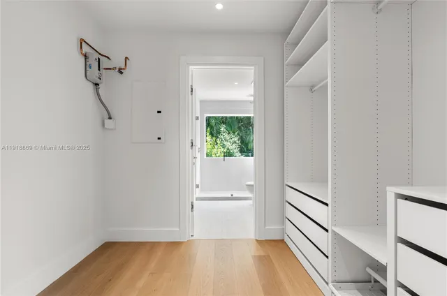 a view of room with window and hardwood floor