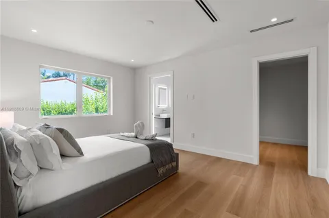 a bedroom with a bed and a table