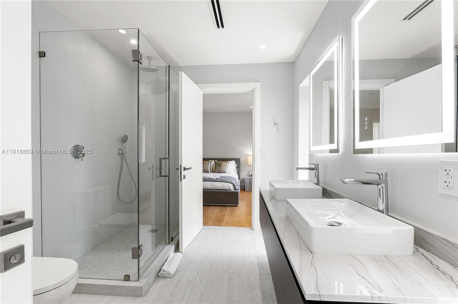 45 Northeast 104th Street Miami Shores, FL 33138 - Photo 39 of 52 a en suite bathroom with a tub shower and toilet