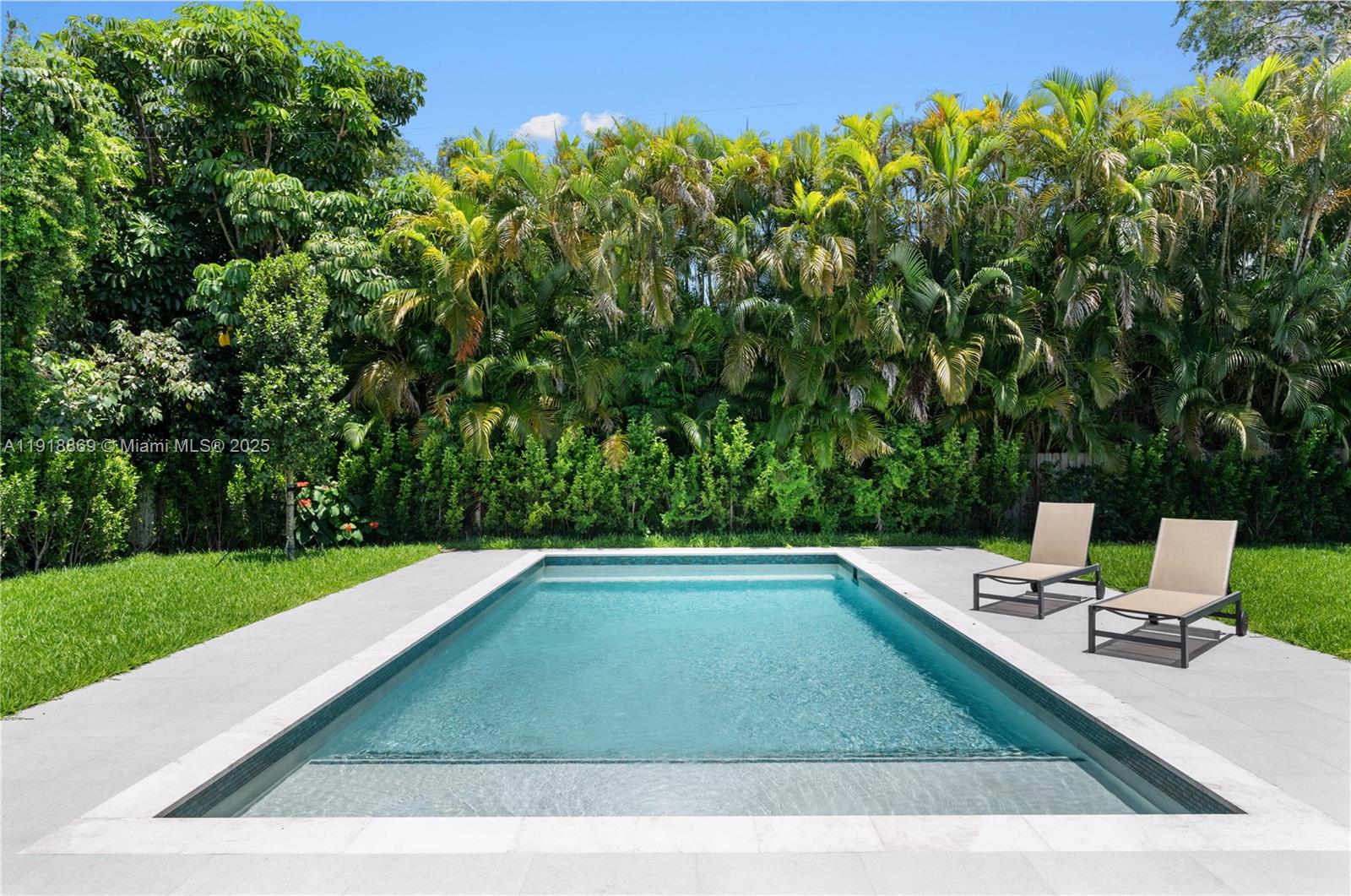 45 Northeast 104th Street Miami Shores, FL 33138 - Photo 46 of 52 a view of a backyard with lawn chairs