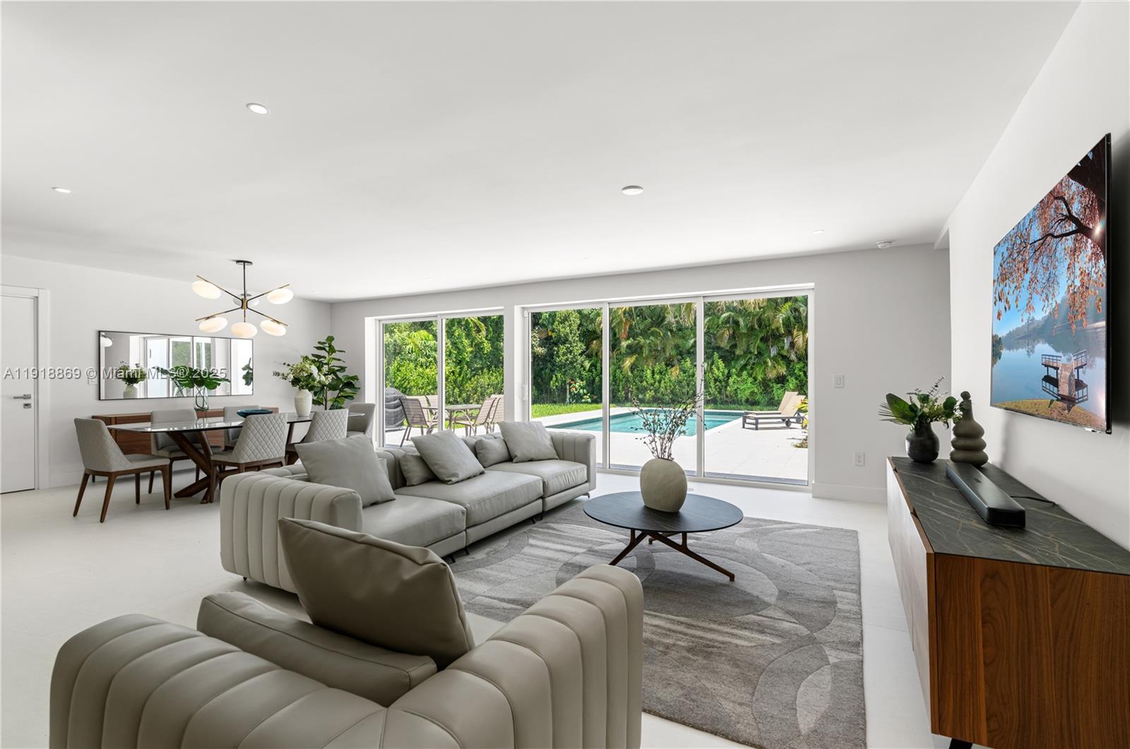 45 Northeast 104th Street Miami Shores, FL 33138 - Photo 7 of 52 a living room with furniture and a large window