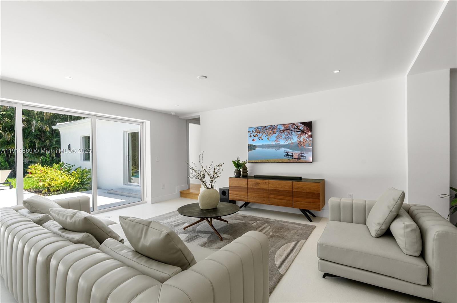 45 Northeast 104th Street Miami Shores, FL 33138 - Photo 8 of 52 a living room with furniture and a couch