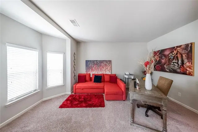 a bedroom with furniture and a window