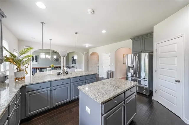 a kitchen with a table and chairs in it