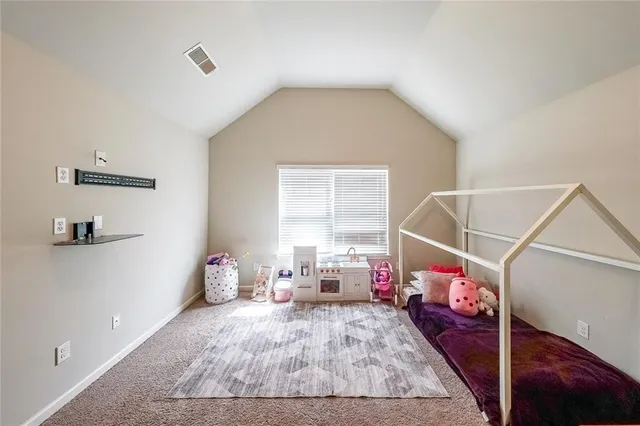 a bed room with a bed and a window