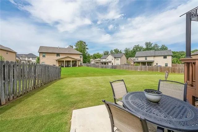 a view of a chairs and table in patio