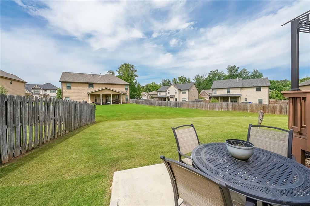 8097 White Oak Loop Lithonia, GA 30038 - Photo 5 of 25 a view of a chairs and table in patio