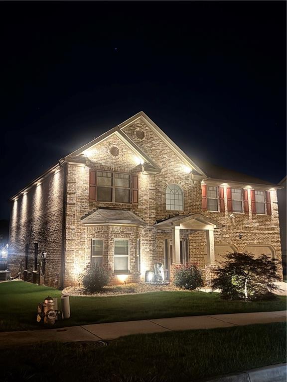 8097 White Oak Loop Lithonia, GA 30038 - Photo 7 of 25 a front view of a house with a yard