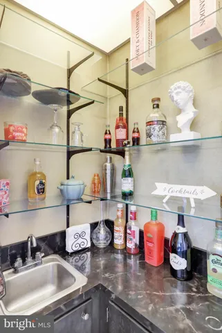 a kitchen with lots of clutter and cabinets