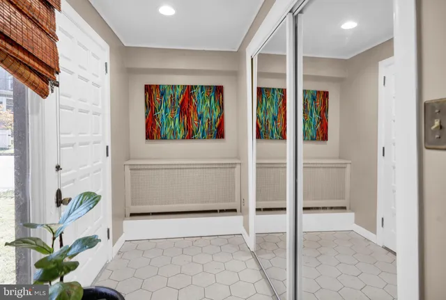 a view of entryway with window and wooden floor