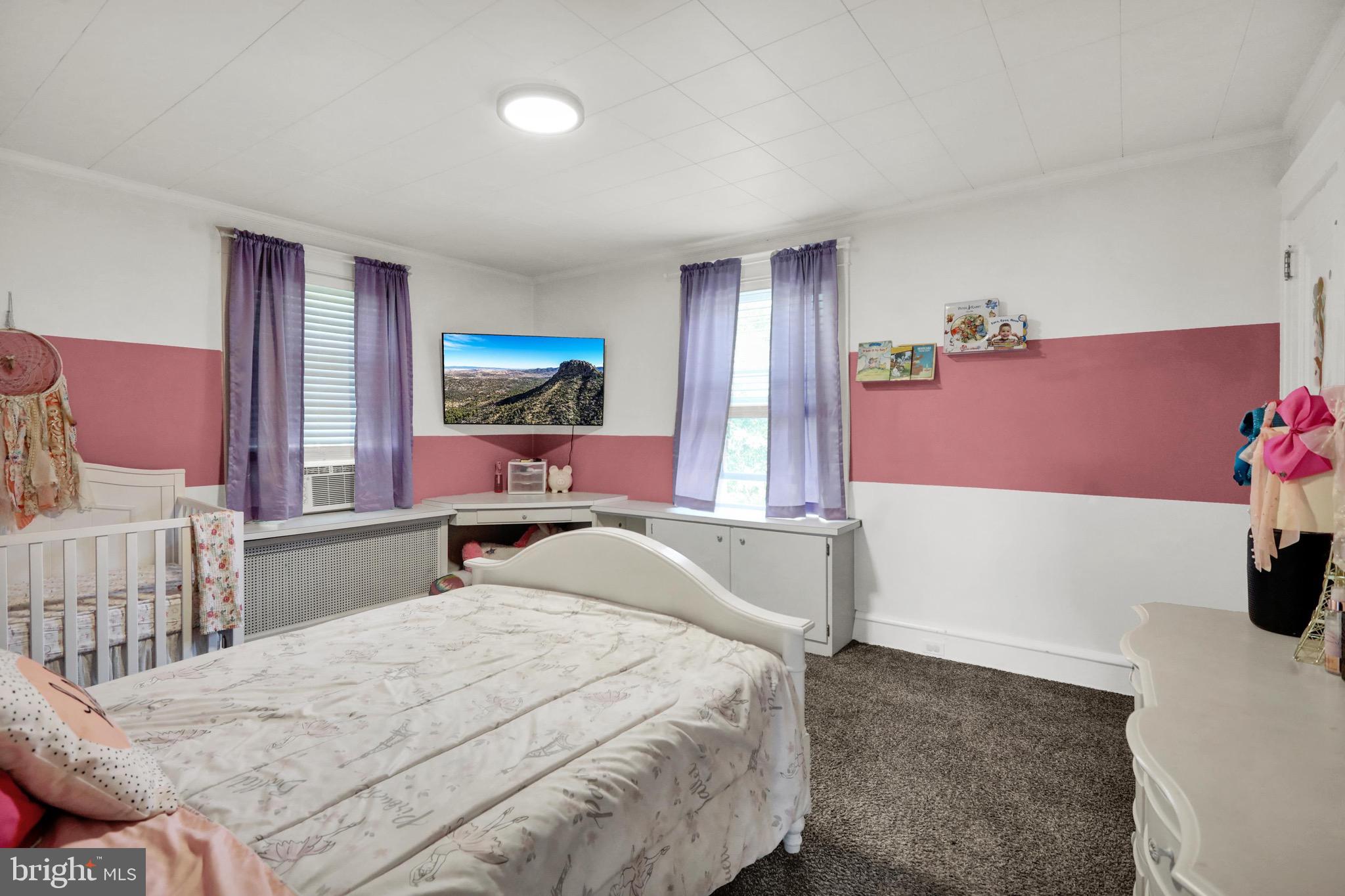 1511 Union Street Reading, PA 19604 - Photo 19 of 37 a bedroom with a bed and a dresser