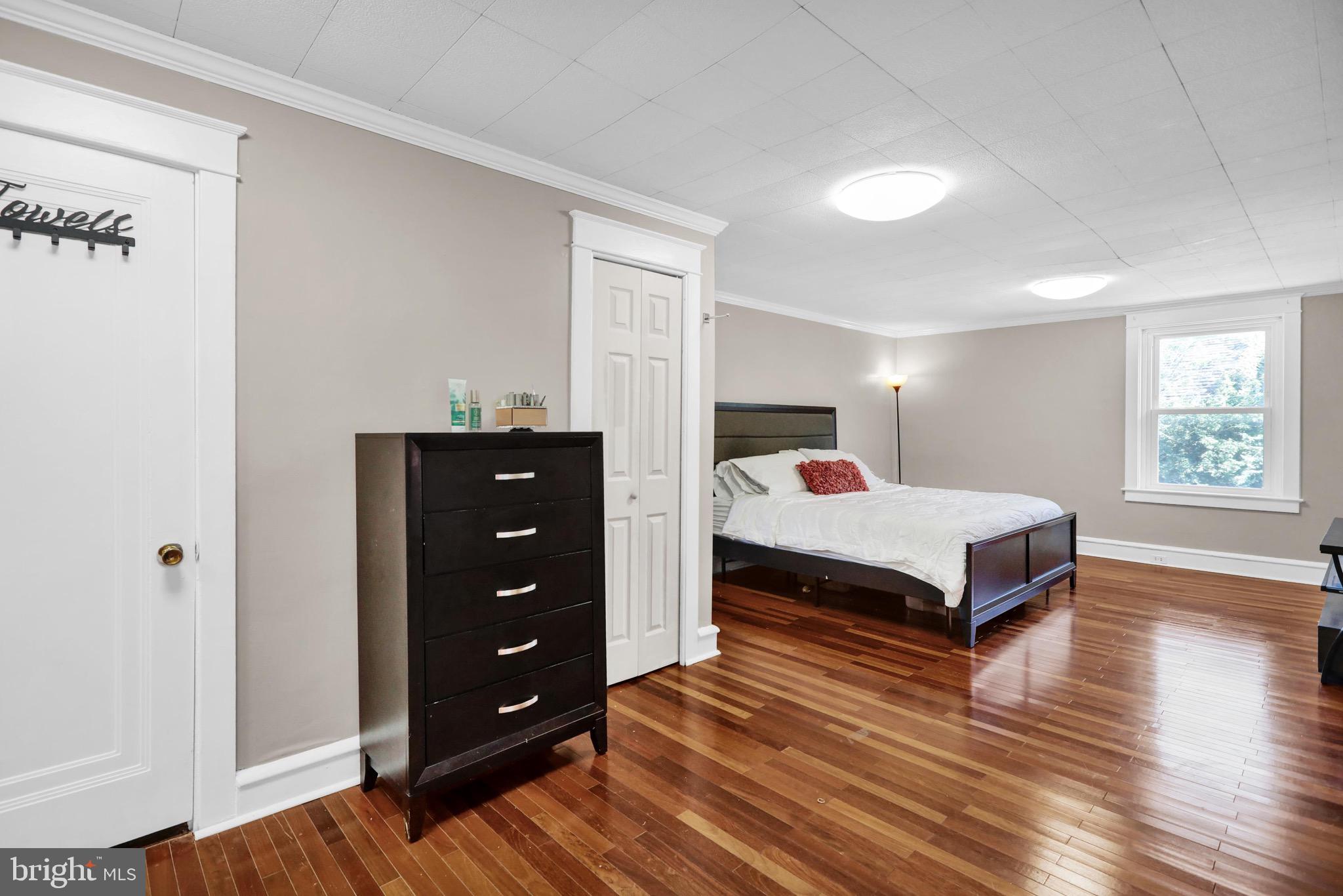 1511 Union Street Reading, PA 19604 - Photo 25 of 37 a bedroom with a bed and a dresser