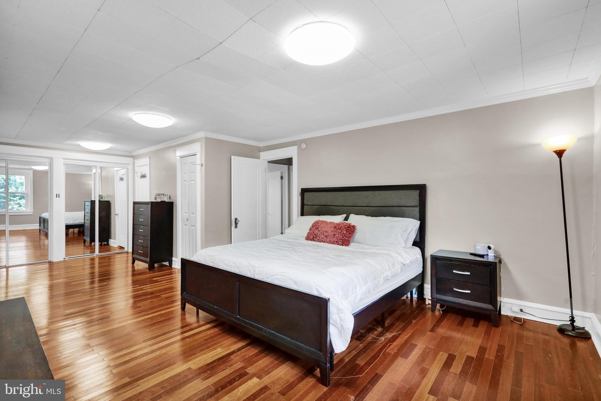 1511 Union Street Reading, PA 19604 - Photo 27 of 37 a spacious bedroom with a bed and wooden floor