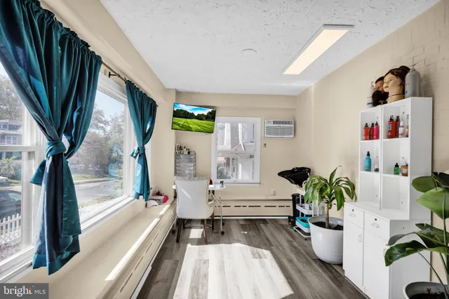 a view of living room with furniture and a flat screen tv
