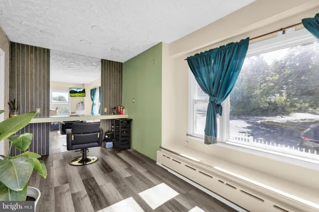 a work room with furniture and a window