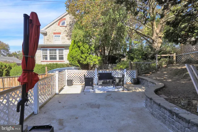 a view of a patio with table and chairs and potted plants