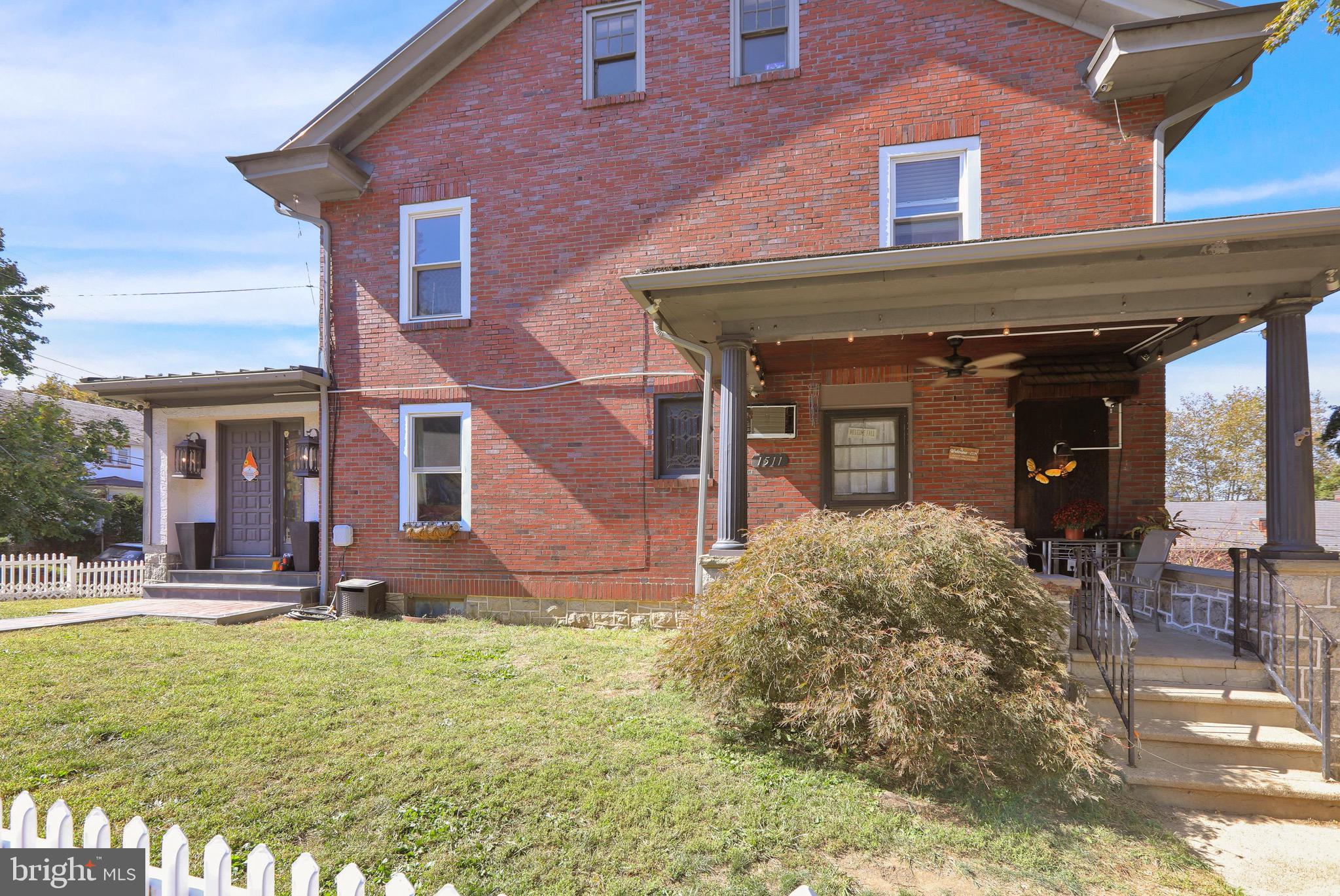 1511 Union Street Reading, PA 19604 - Photo 4 of 37 front view of a brick house with a yard