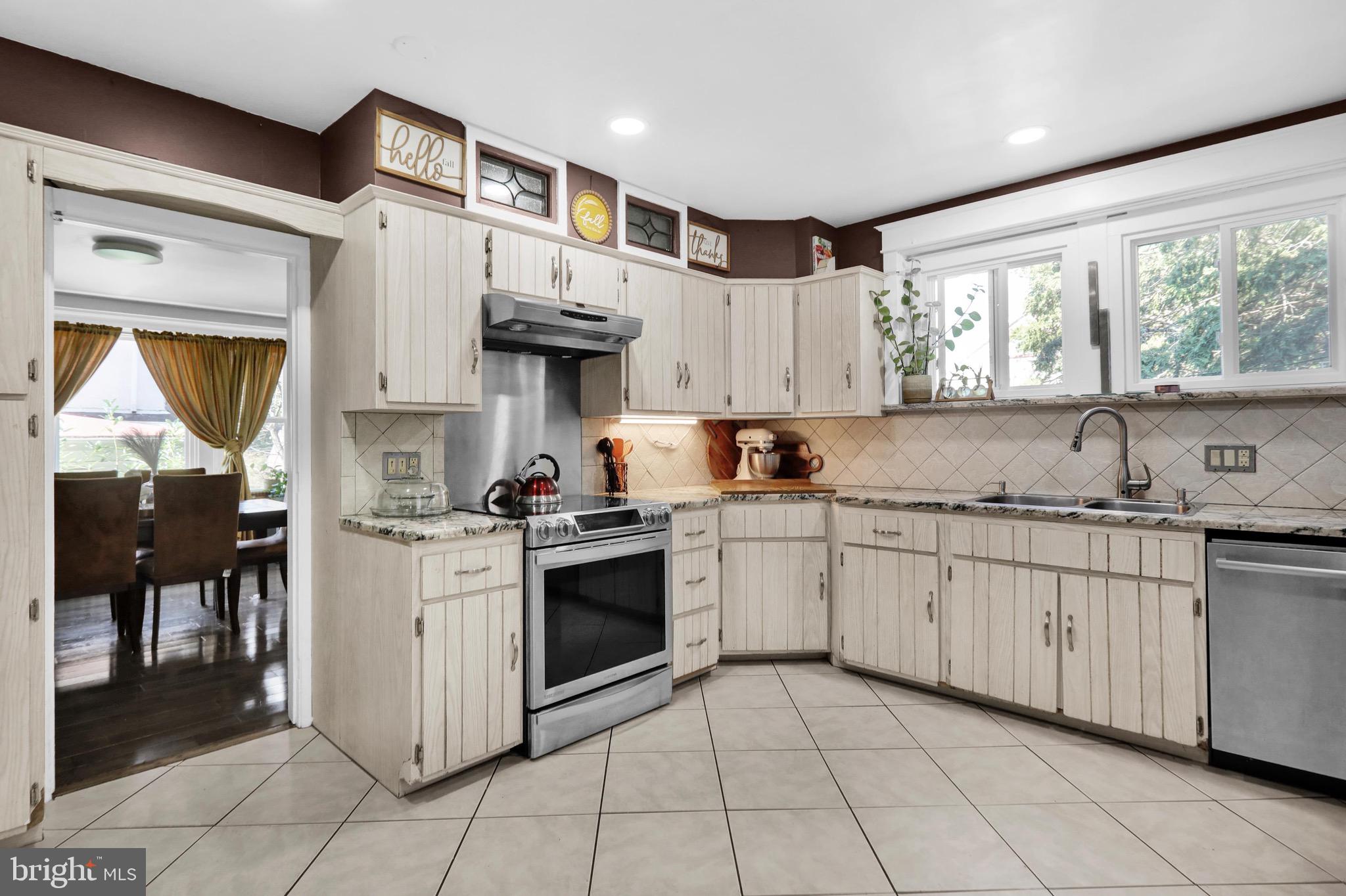 1511 Union Street Reading, PA 19604 - Photo 6 of 37 a kitchen with granite countertop a sink stove and cabinets