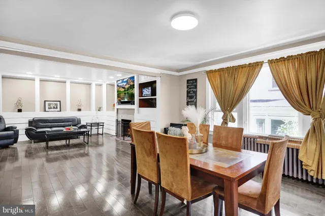 a view of a dining room with furniture and window