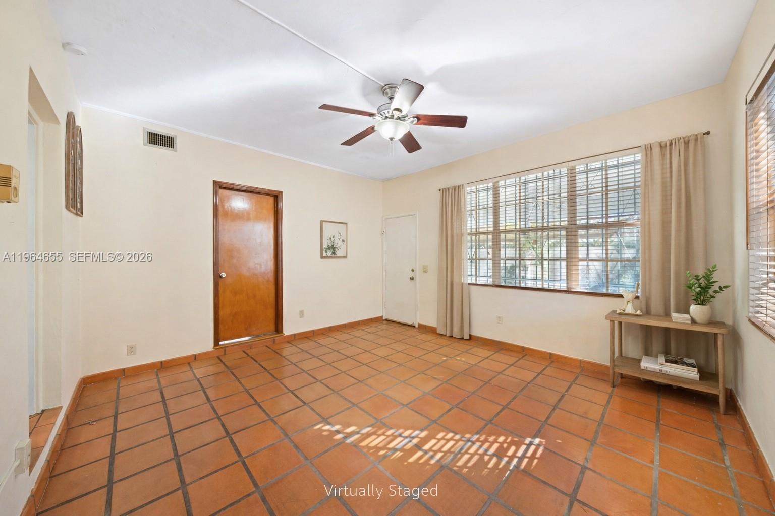 7110 Southwest 13th Terrace Miami, FL 33144 - Photo 15 of 39 a view of empty room with window and ceiling fan