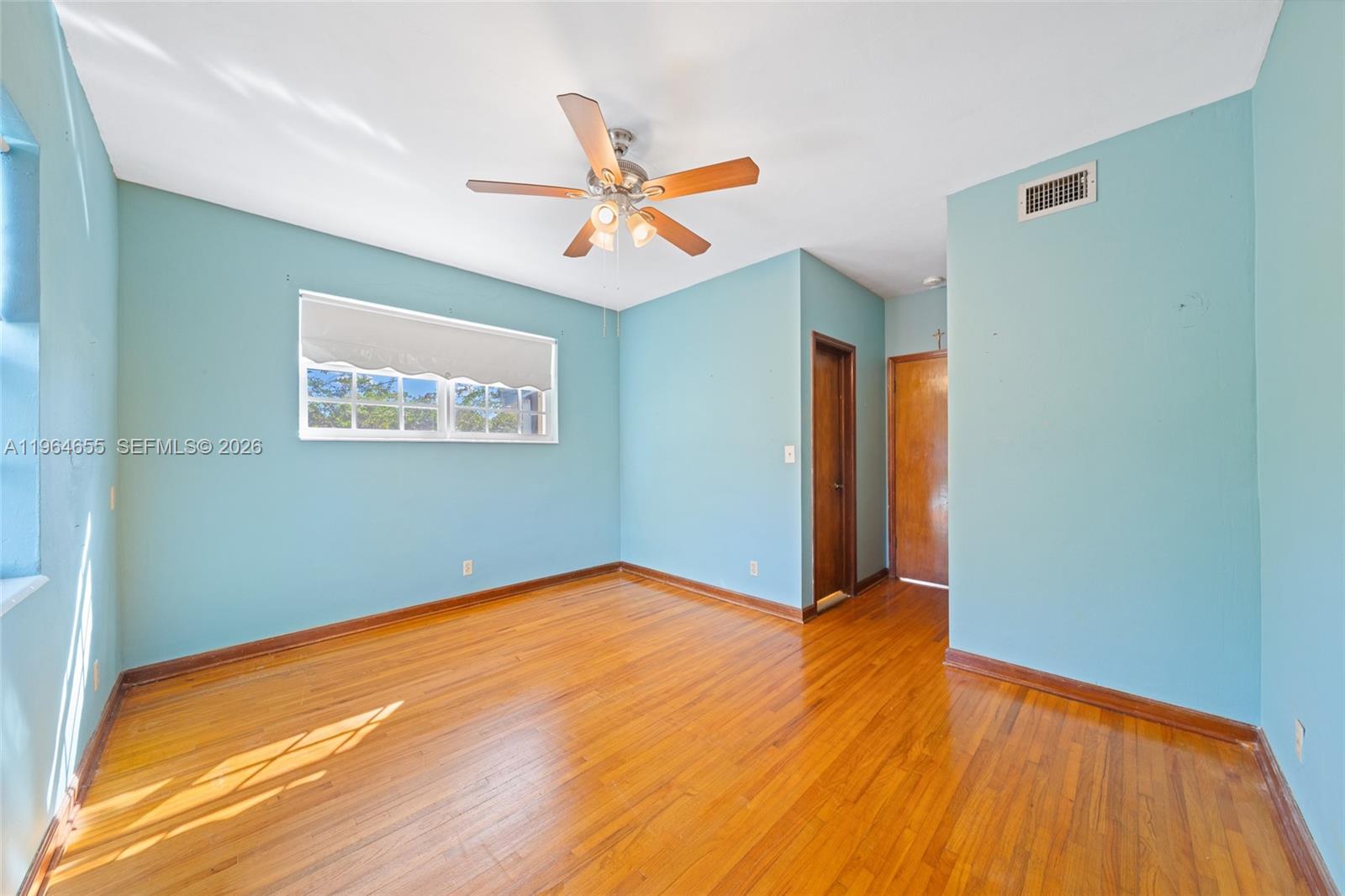 7110 Southwest 13th Terrace Miami, FL 33144 - Photo 17 of 39 a view of empty room with wooden floor
