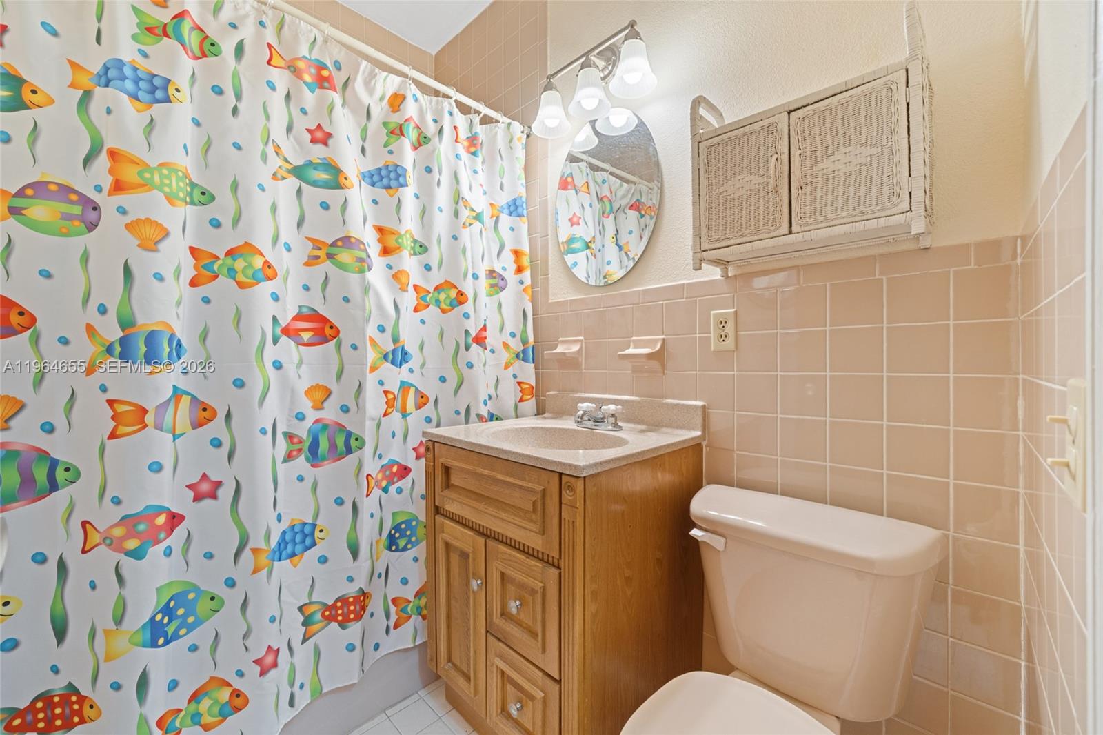 7110 Southwest 13th Terrace Miami, FL 33144 - Photo 19 of 39 a bathroom with a sink toilet and shower