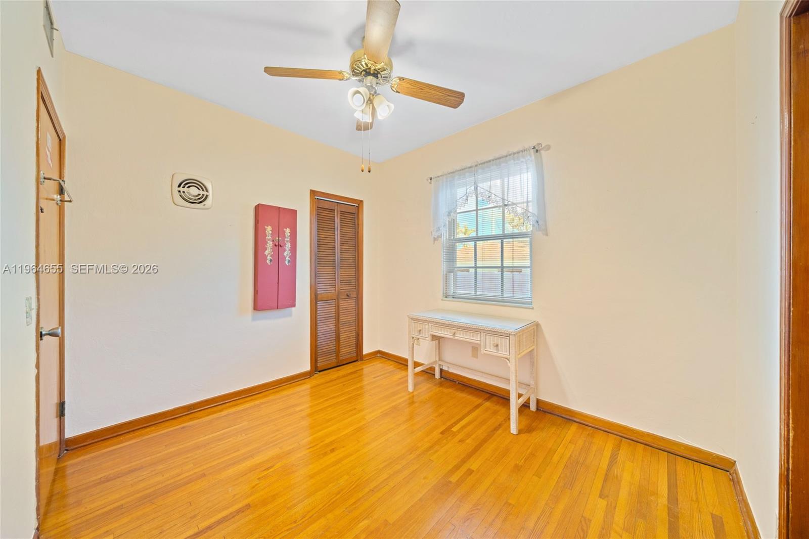 7110 Southwest 13th Terrace Miami, FL 33144 - Photo 21 of 39 a view of an empty room with a window