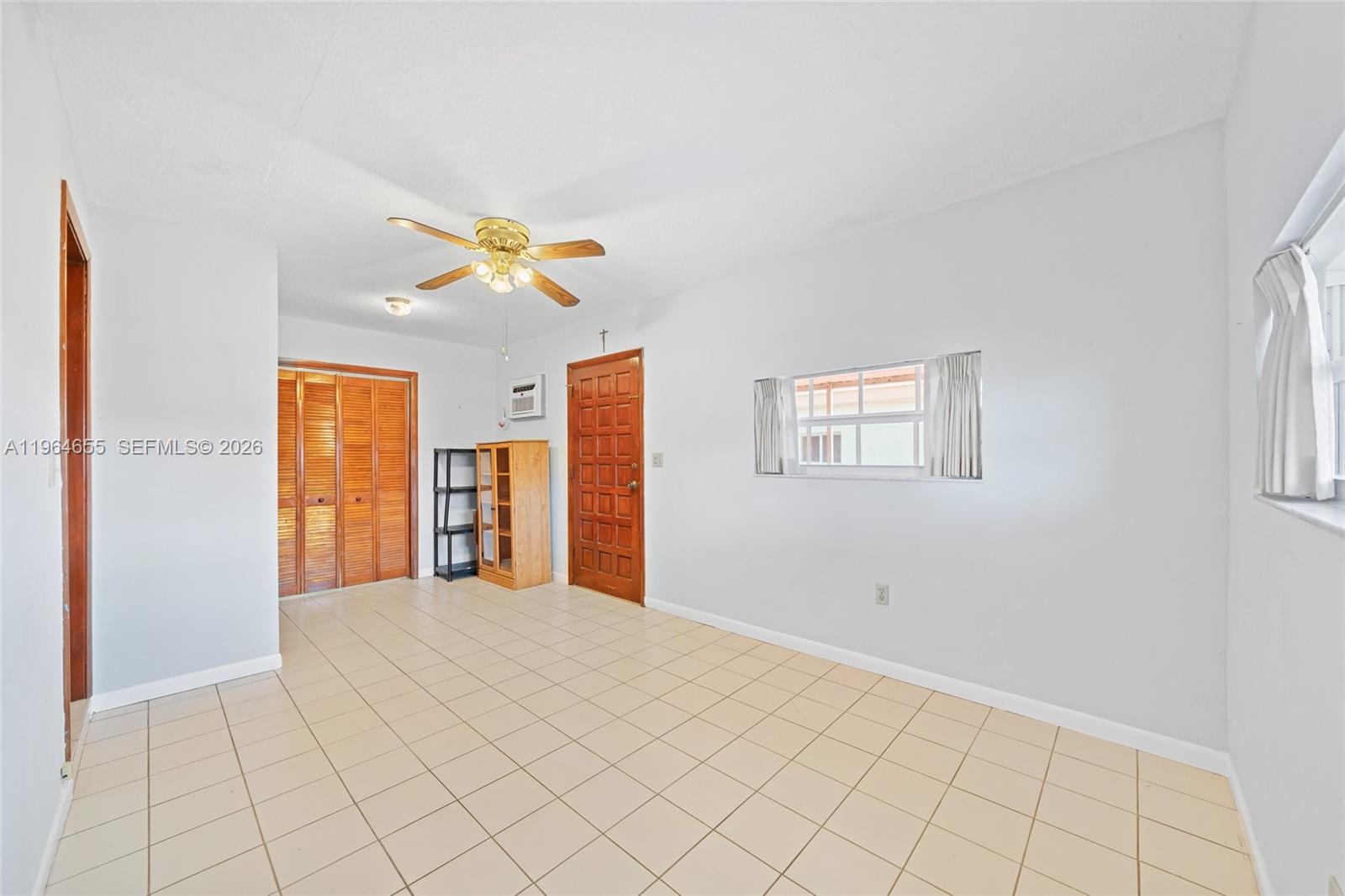 7110 Southwest 13th Terrace Miami, FL 33144 - Photo 26 of 39 a bedroom with a bed and a painting on the wall