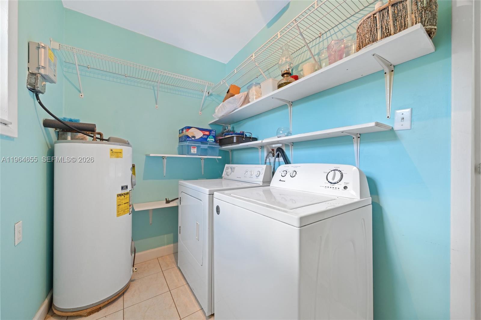 7110 Southwest 13th Terrace Miami, FL 33144 - Photo 30 of 39 a utility room with dryer and washer