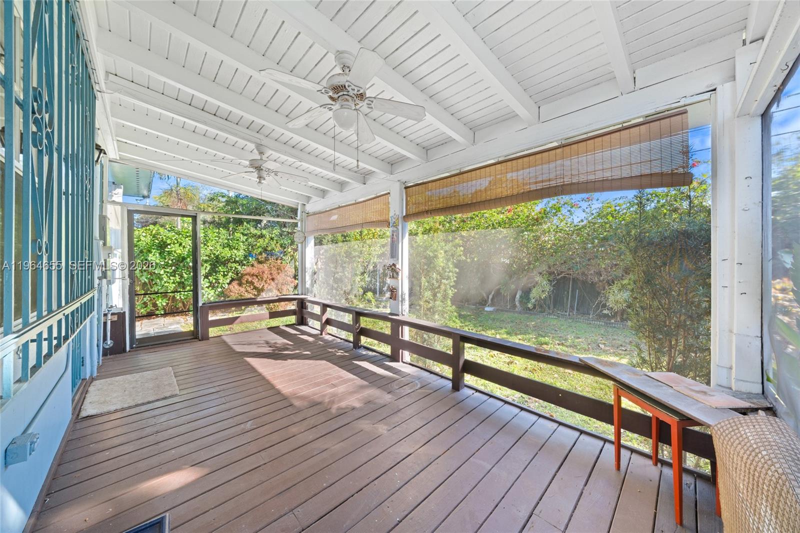 7110 Southwest 13th Terrace Miami, FL 33144 - Photo 31 of 39 a view of a room with wooden floor and outdoor space