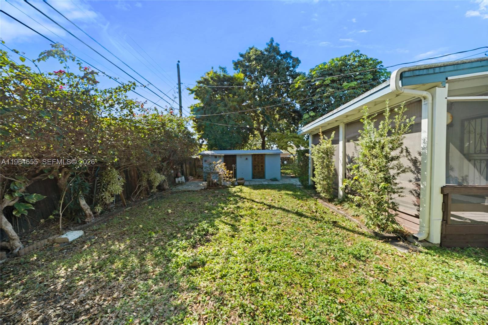 7110 Southwest 13th Terrace Miami, FL 33144 - Photo 33 of 39 a view of a yard with plants and large trees