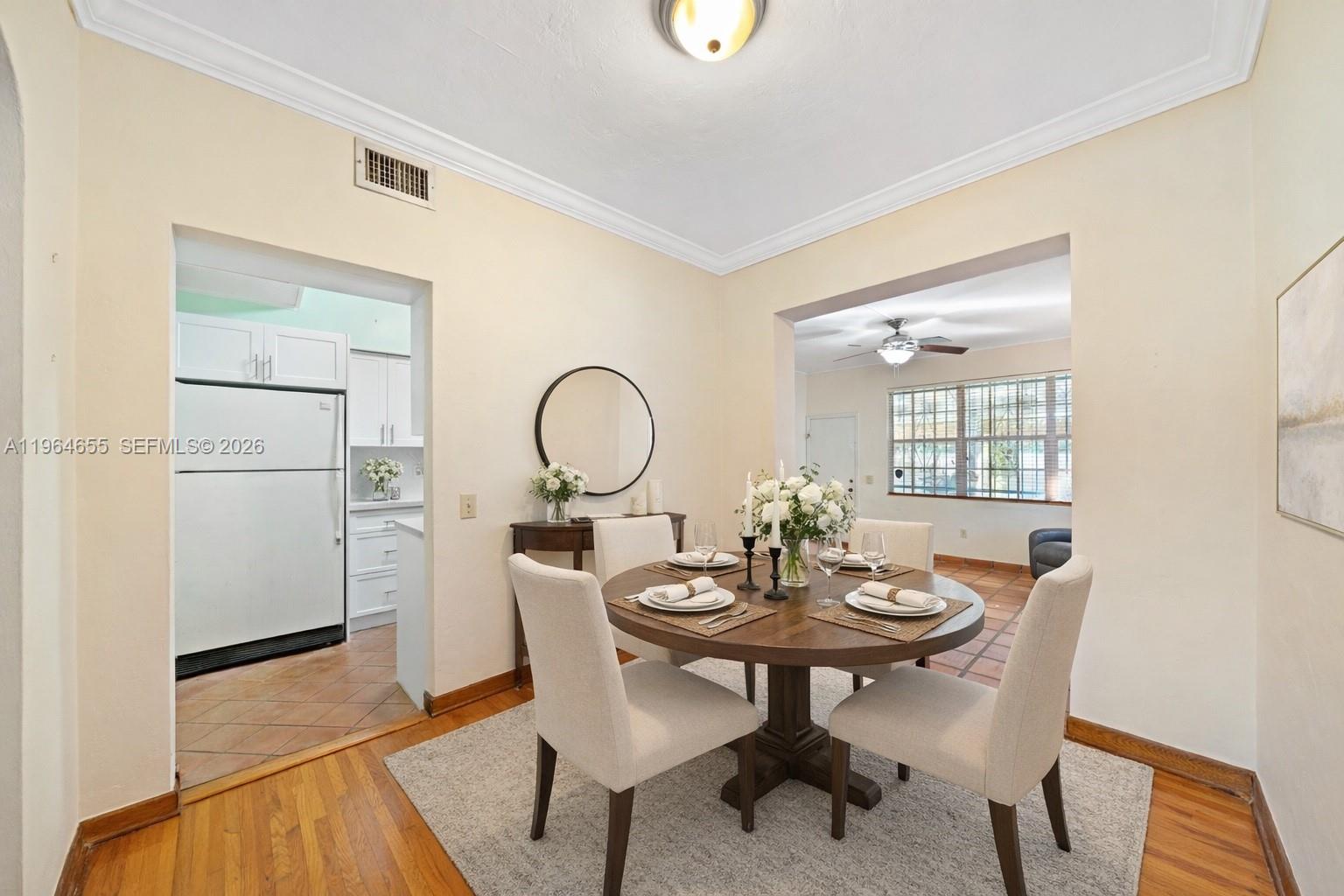 7110 Southwest 13th Terrace Miami, FL 33144 - Photo 9 of 39 a view of a dining room with a table and chairs