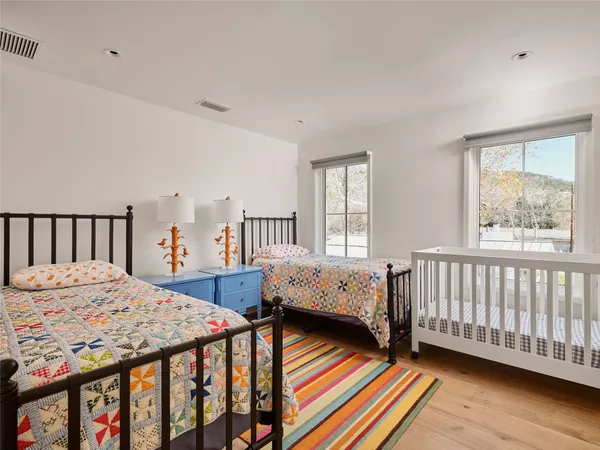 a bedroom with furniture and a window