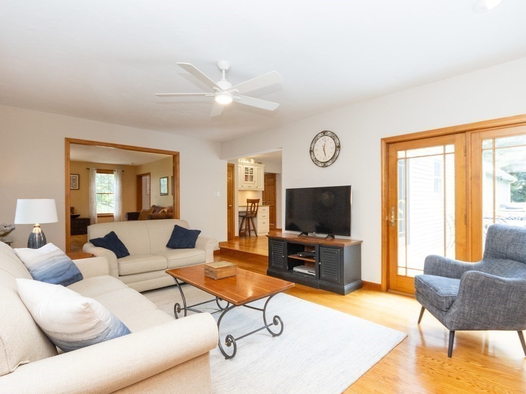 72 Emerson Road Walpole, MA 02032 - Photo 11 of 41 a living room with furniture and a flat screen tv