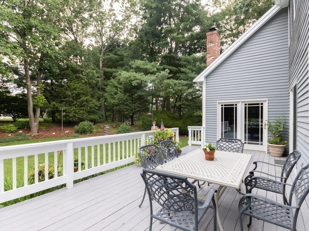 72 Emerson Road Walpole, MA 02032 - Photo 12 of 41 a view of a patio with a table and chairs