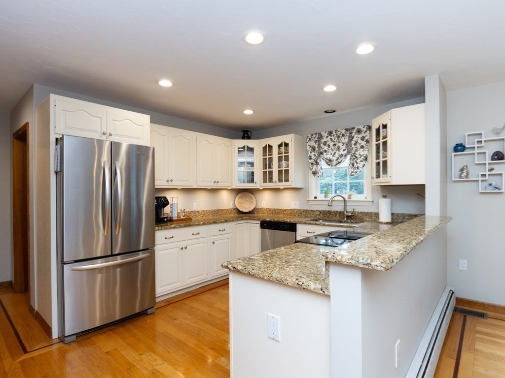 72 Emerson Road Walpole, MA 02032 - Photo 15 of 41 a kitchen with a refrigerator a stove a sink and a refrigerator