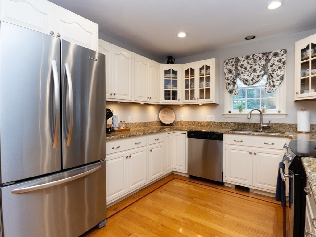 72 Emerson Road Walpole, MA 02032 - Photo 16 of 41 a kitchen with granite countertop a refrigerator stove top oven and sink
