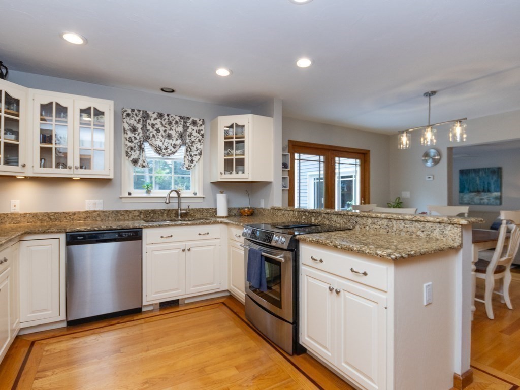 72 Emerson Road Walpole, MA 02032 - Photo 17 of 41 a kitchen with granite countertop stainless steel appliances sink stove and cabinets
