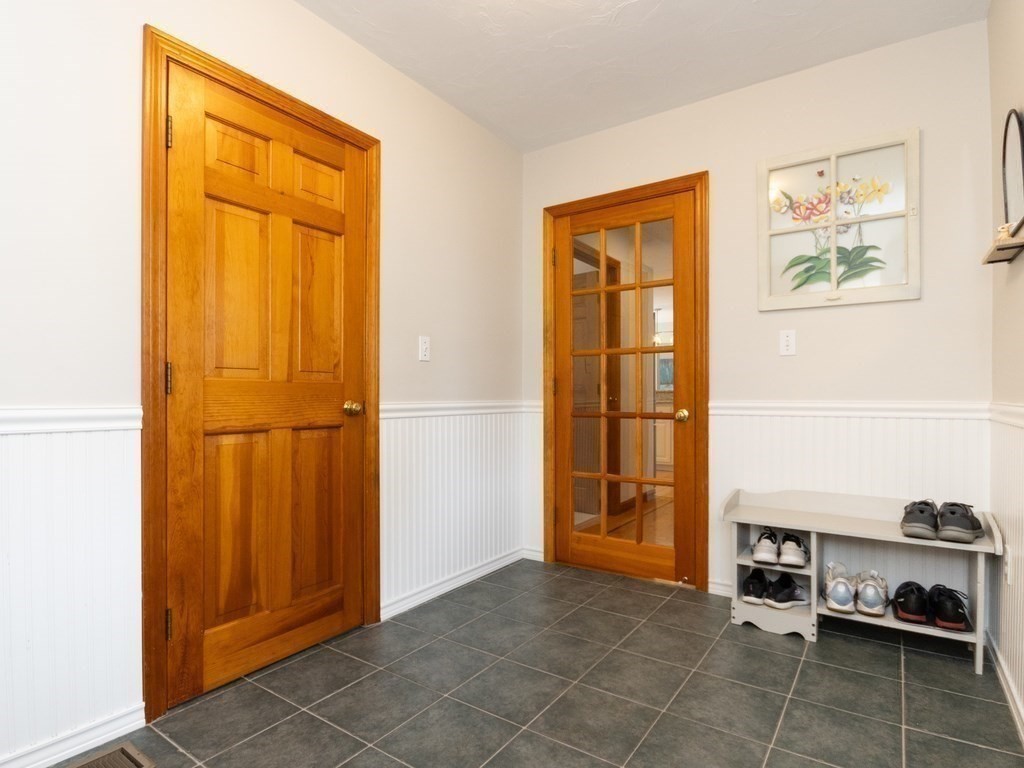 72 Emerson Road Walpole, MA 02032 - Photo 19 of 41 a view of a livingroom with wooden floor and a refrigerator