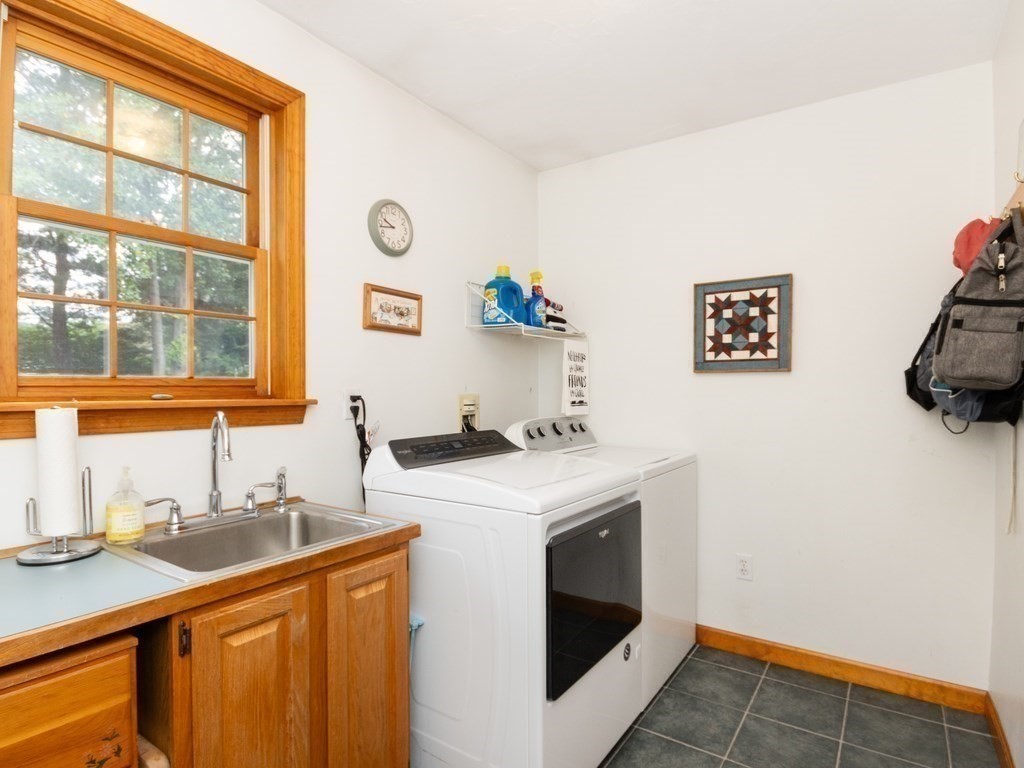 72 Emerson Road Walpole, MA 02032 - Photo 20 of 41 a kitchen with a sink cabinets and window