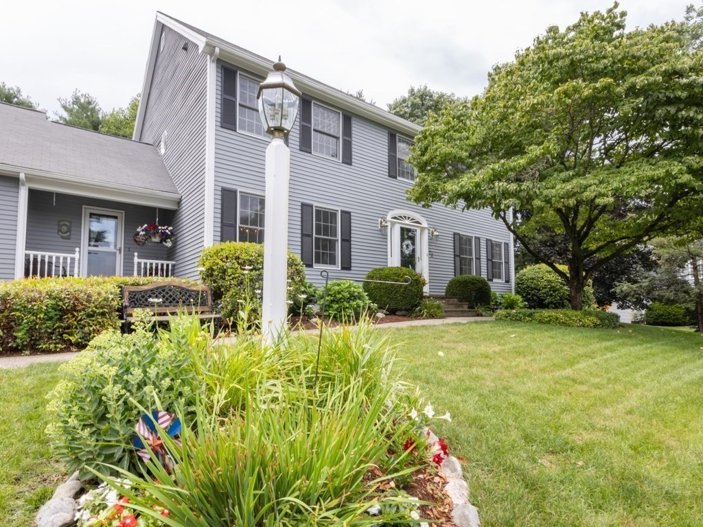 72 Emerson Road Walpole, MA 02032 - Photo 2 of 41 a front view of house with yard and green space