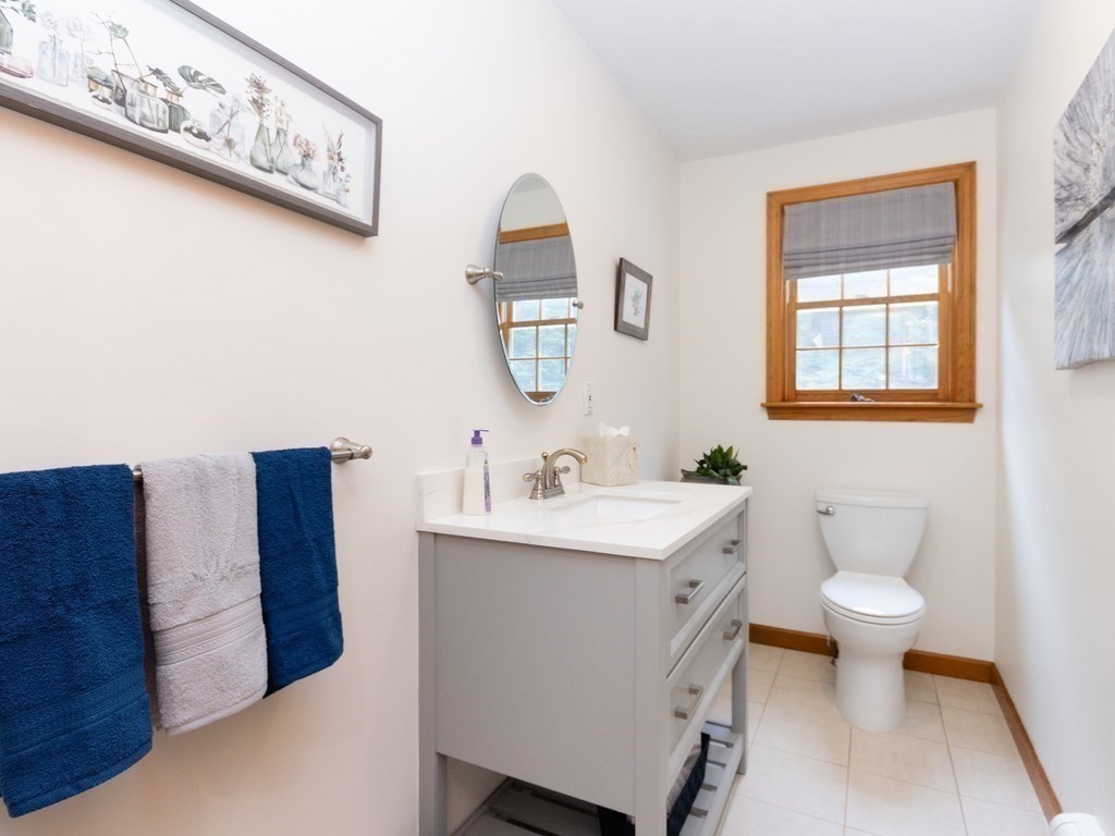 72 Emerson Road Walpole, MA 02032 - Photo 21 of 41 a bathroom with a toilet sink and mirror