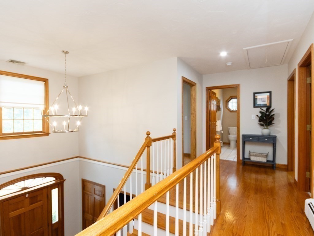 72 Emerson Road Walpole, MA 02032 - Photo 22 of 41 a view of entryway and hall with wooden floor