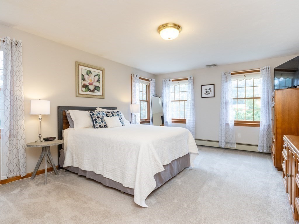 72 Emerson Road Walpole, MA 02032 - Photo 24 of 41 a bedroom with a bed and a window